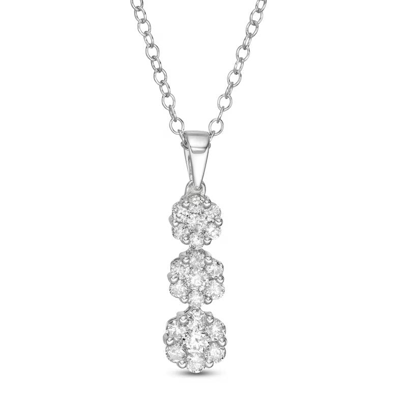 1/2 CT. T.W. Multi-Diamond Graduated Three Stone Flower Pendant in 10K White Gold