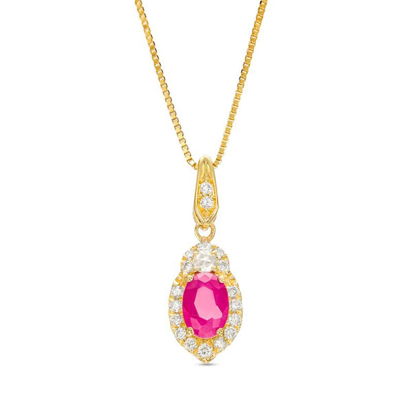 Oval Ruby and 1/6 CT. T.W. Diamond Frame Pendant in 10K Gold